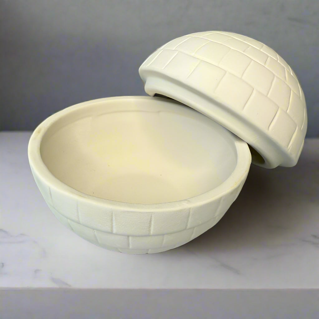 White woven bowl and cover on a wooden surface