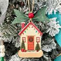 Decorative Christmas ornament shaped like a house with lights on a tree. New Home Realtor Gift Amelia Island.