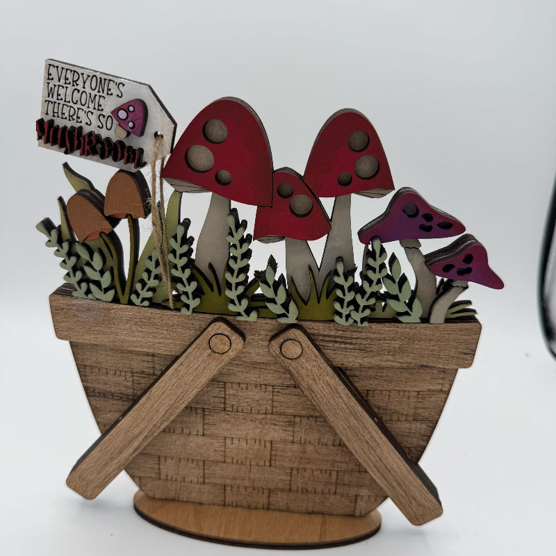 Wooden basket with colorful mushrooms and a sign on a white background