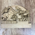 Wooden decorative sign with 'Home Sweet Home' text and birdhouse design on a wooden background
