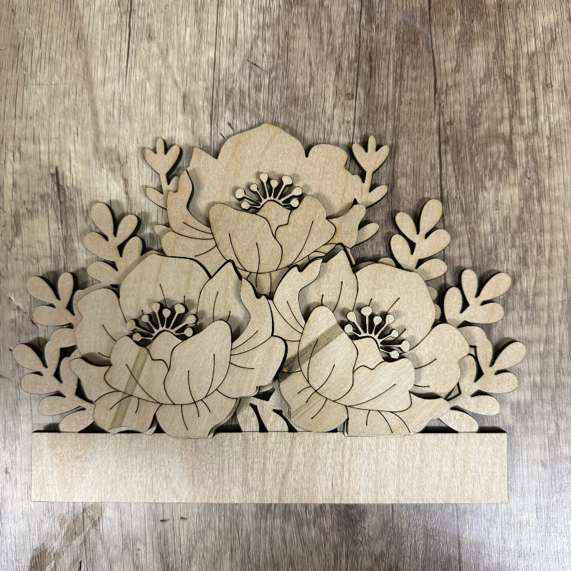 Wooden floral cutout on a wooden surface