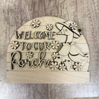 Wooden sign with 'Welcome to our Porch' text and bird design on a wooden background