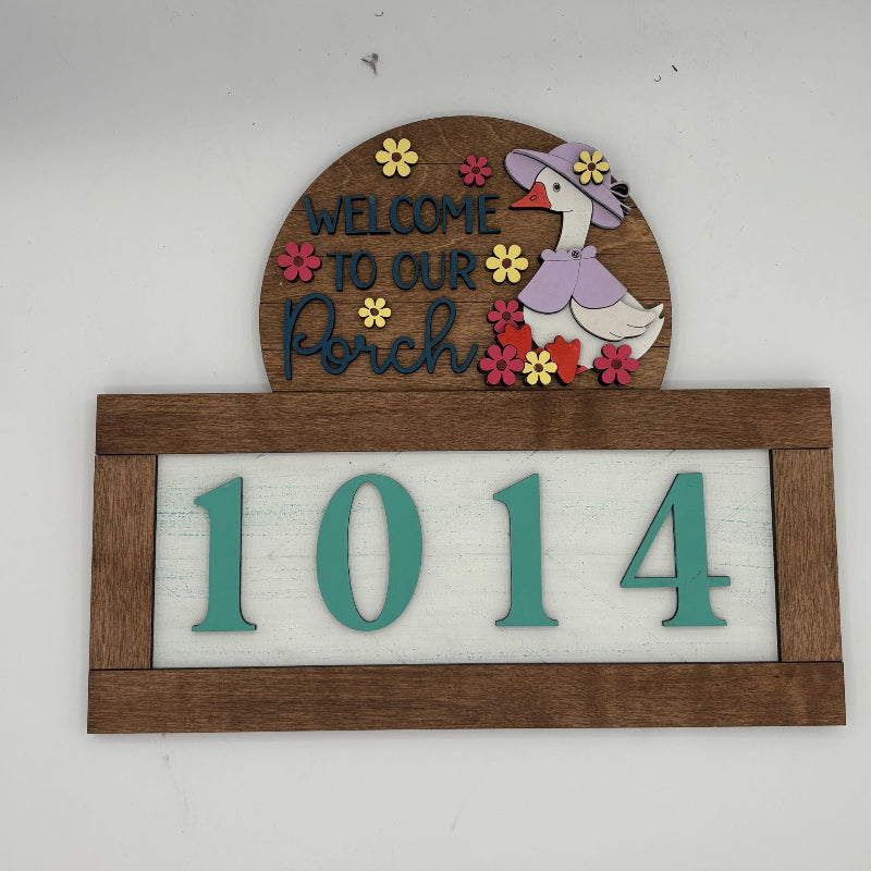 Decorative house number sign with a duck illustration and 'Welcome to our Porch' text on a white background.
