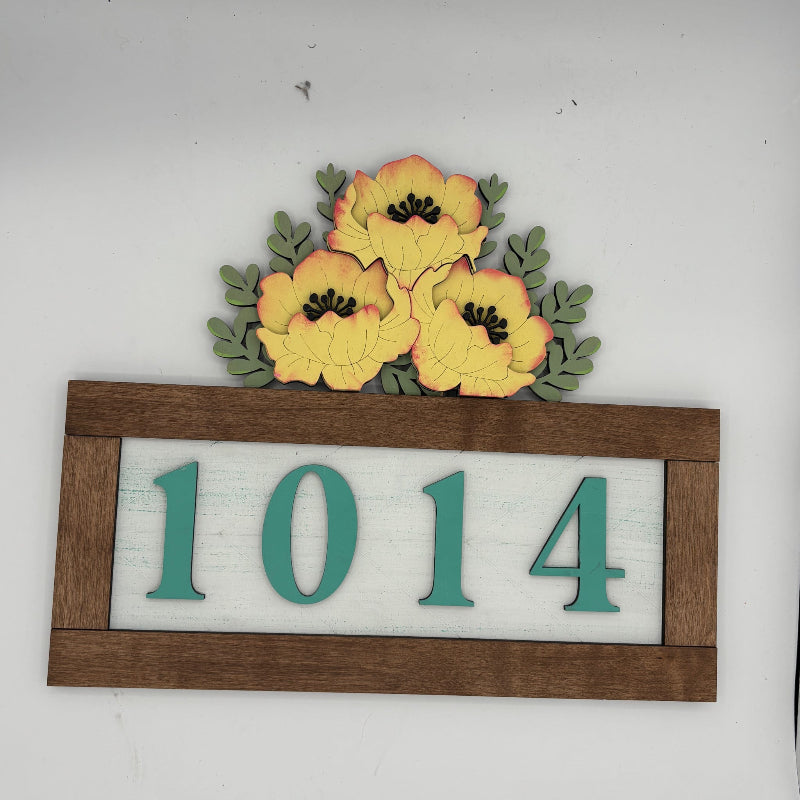House number sign with flowers on a white background
