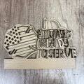 Wooden sign with American flag, helmet, and 'Always Ready to Serve' text on a wooden background