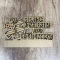 Wooden decorative sign with 'Serving Unselfishly and Continuously' text on a wooden surface