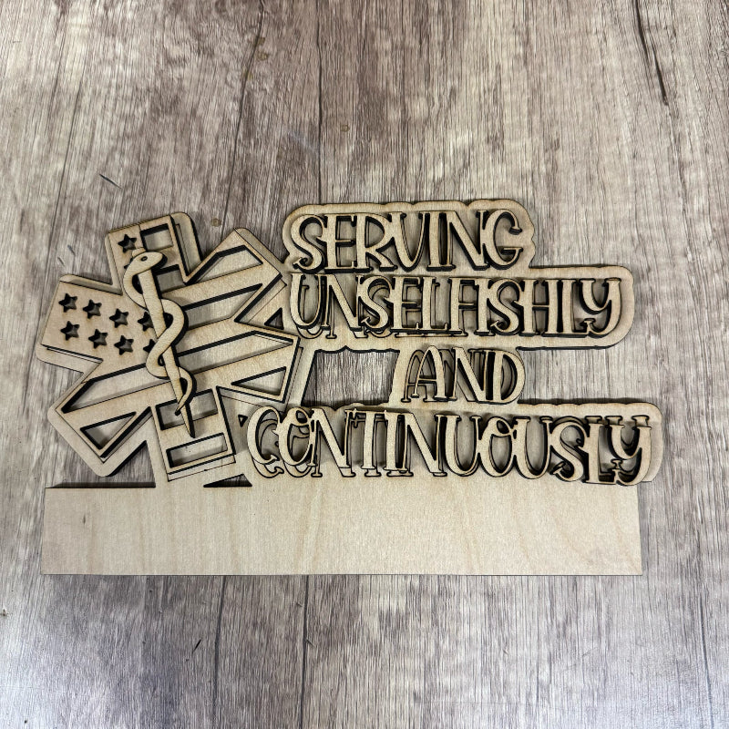 Wooden decorative sign with 'Serving Unselfishly and Continuously' text on a wooden surface