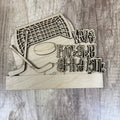 Wooden decorative sign with hockey-themed design and text on a wooden background