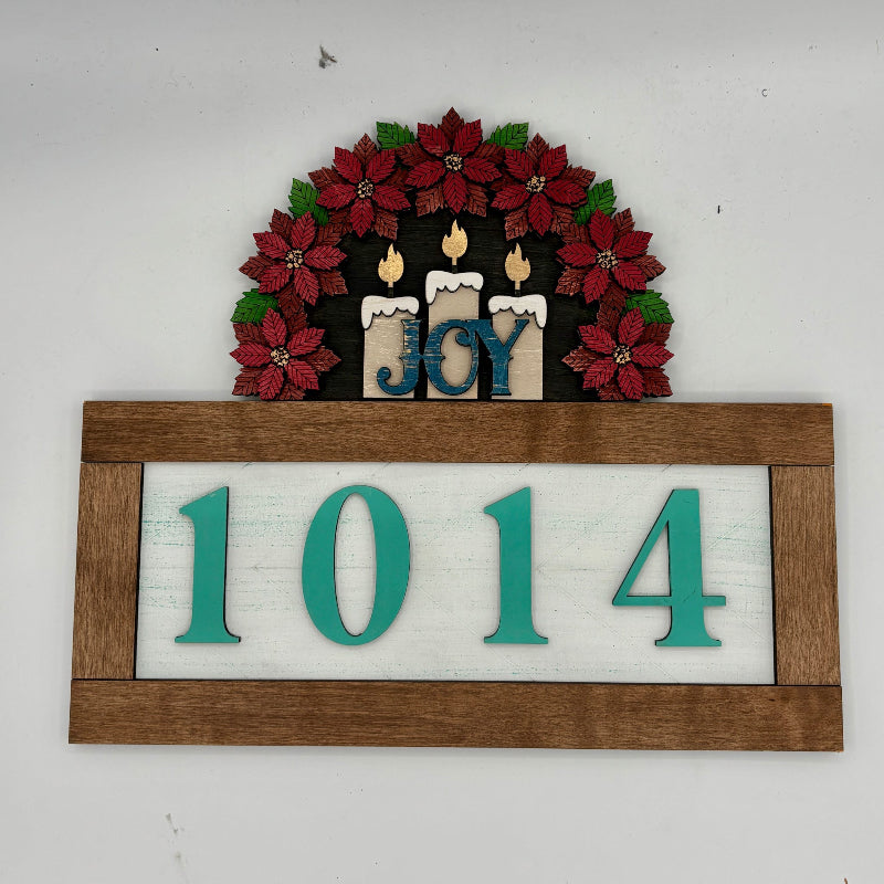 Decorative wall art with poinsettias, candles, 'JOY' text, and house numbers '1014' on a white background.