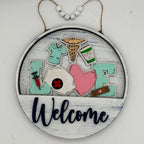 Decorative sign with medical-themed elements and 'Welcome' text on a white background