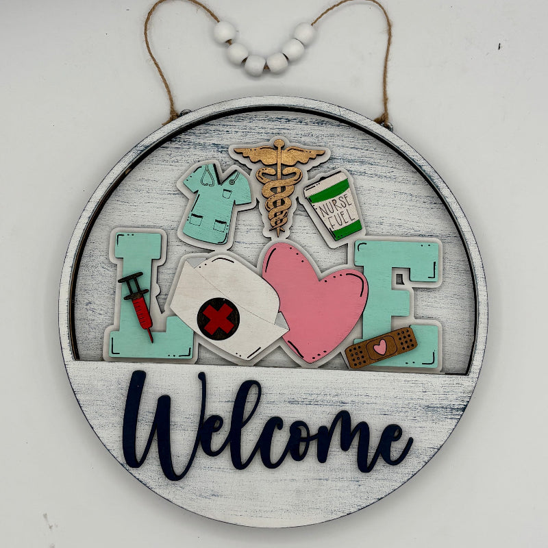Decorative sign with medical-themed elements and 'Welcome' text on a white background