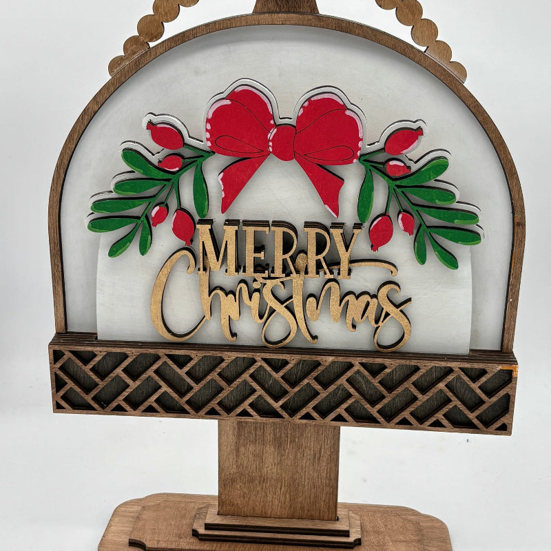 Decorative Christmas sign with 'Merry Christmas' text and bow design on a white background