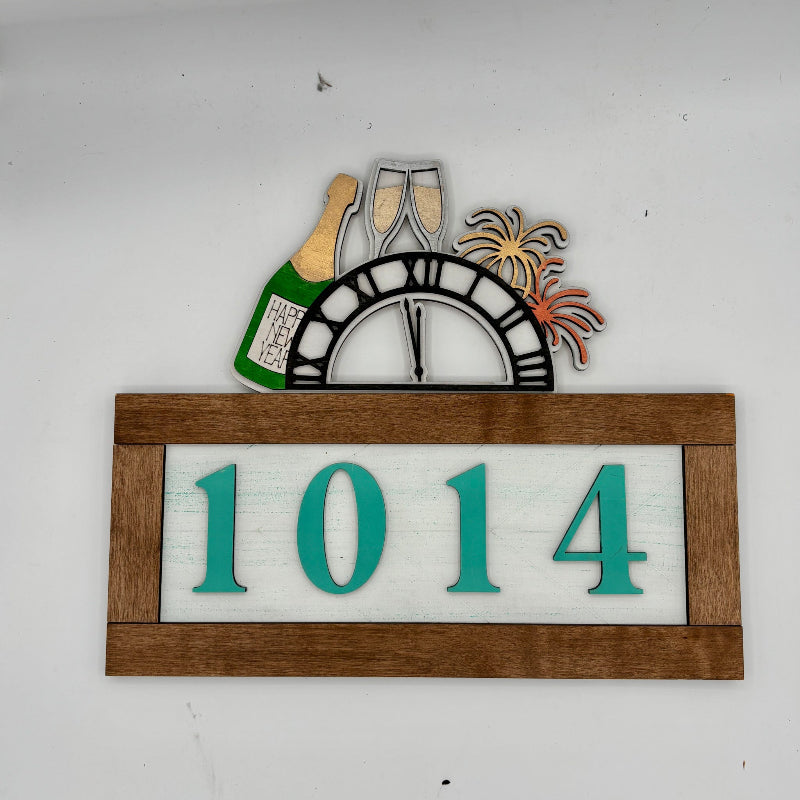 Decorative house number sign with '1014' on a white background