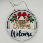 Round wooden ornament with 'Merry Christmas Welcome' text and festive design on a white background