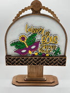 Decorative sign with Mardi Gras-themed design and wooden frame on a white background