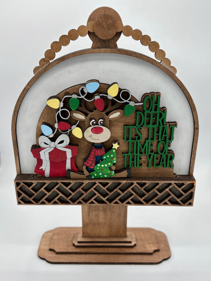 Decorative wooden arch with Christmas-themed elements on a white background