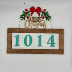 Christmas-themed house number sign with wreath and 'Merry Christmas' text on a white background