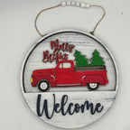 Decorative sign with a red truck and Christmas trees, featuring 'Merry & Bright Welcome' text.