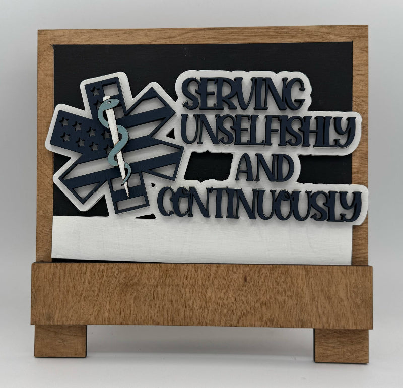 Decorative sign with text 'Serving Unselfishly and Continuously' on a wooden base.