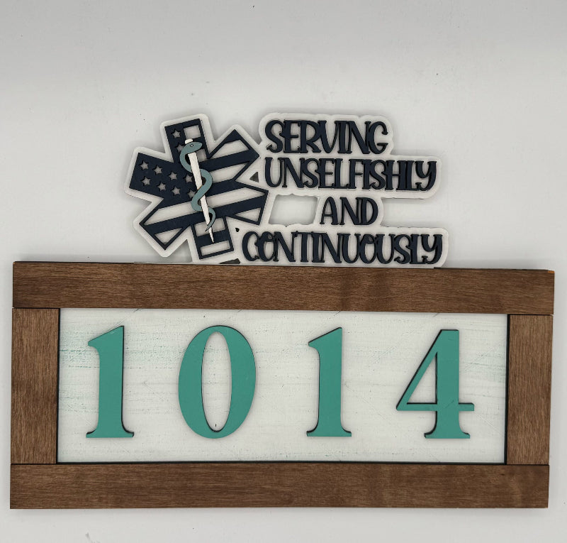 Decorative sign with medical symbol, text 'Serving Unselfishly and Continuously' and numbers '1014' on a white background.