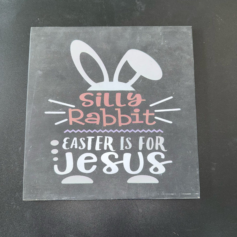 Transparent stencil with 'Silly Rabbit Easter is for Jesus' text on a black background