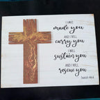 Wooden cross with marbled design on a white background with Bible verse text.