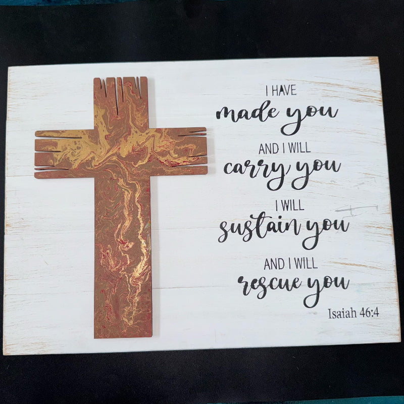 Wooden cross with marbled design on a white background with Bible verse text.