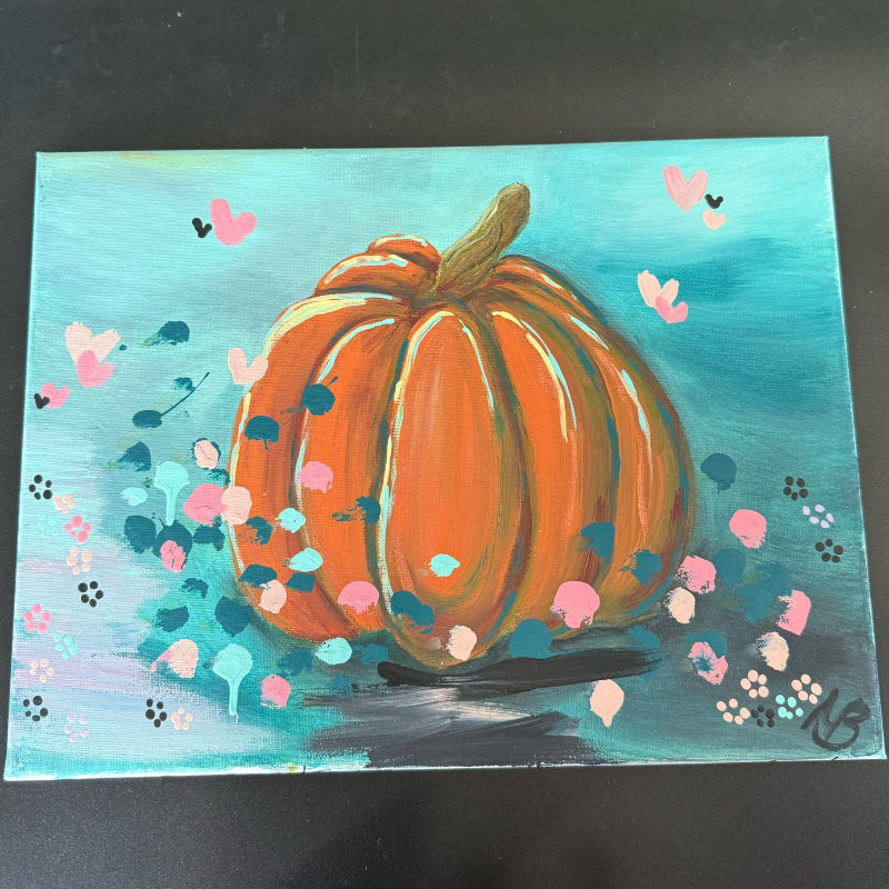 Painting of a pumpkin with decorative elements on a blue background