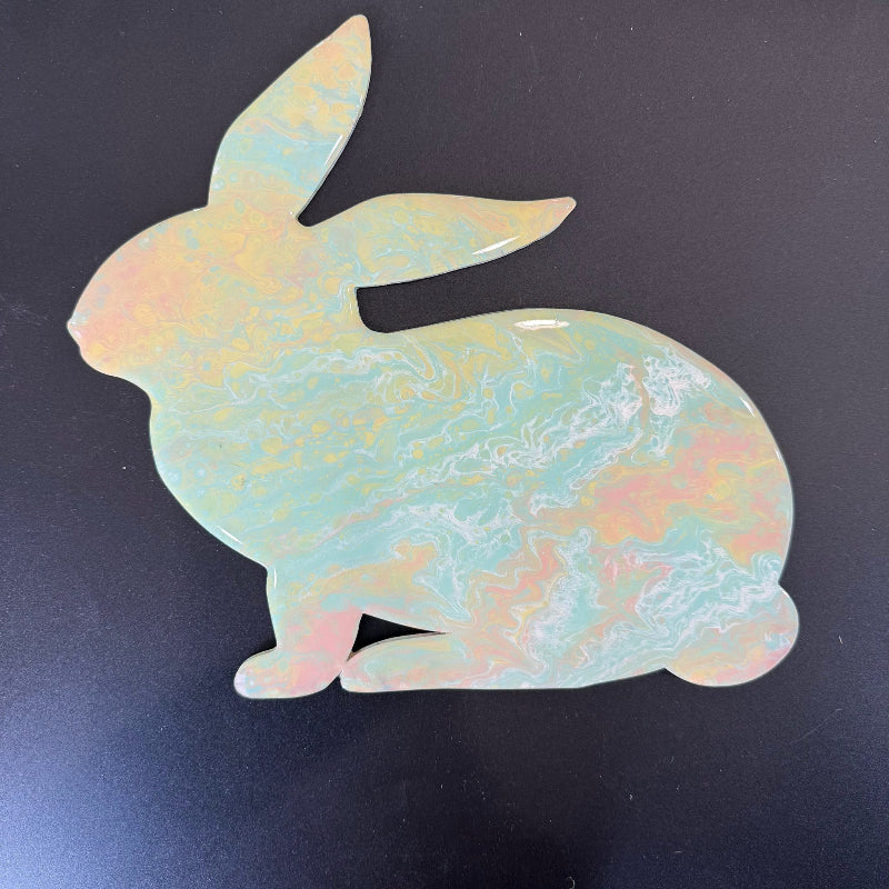 Opalite turtle-shaped crystal on a black background