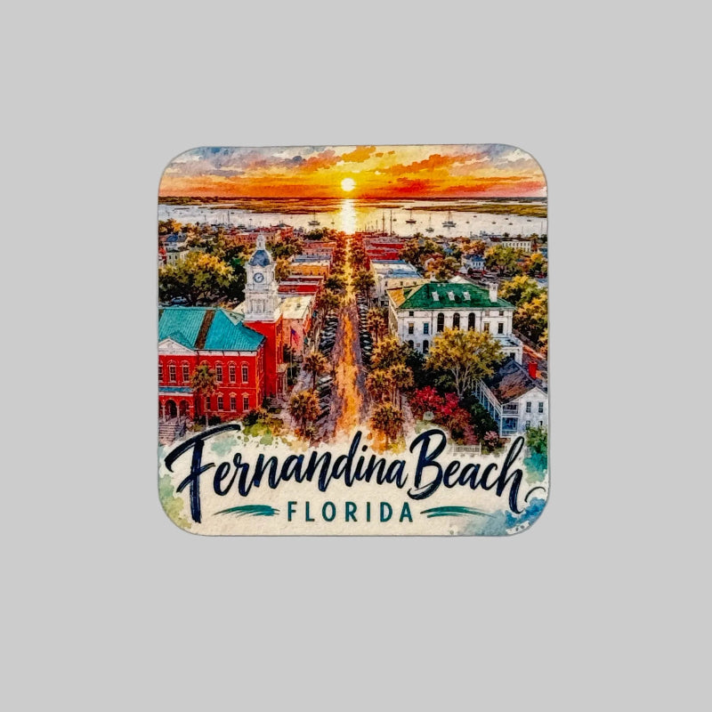 A square coaster with rounded corners featuring a colorful watercolor-style illustration of Fernandina Beach, Florida, with the text 'Fernandina Beach FLORIDA' at the bottom, shown on a light textured background.