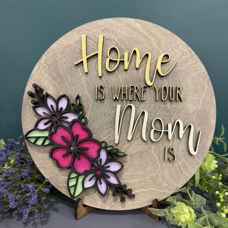 3D layered wooden wall art with the text 'Home is Where your Mom Is' and floral designs