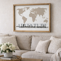 Living room with a beige sofa, coffee table, and world map artwork on the wall. DIY Art project. Travel Gifts. World Map for House. 