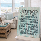 Decorative sign with 'Beachology' text in a living room with ocean view