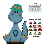 Blue dinosaur figurine with a turquoise hat and sunglasses, surrounded by additional hats on a white background.
