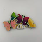 Colorful butterfly-shaped hair clip on a white background