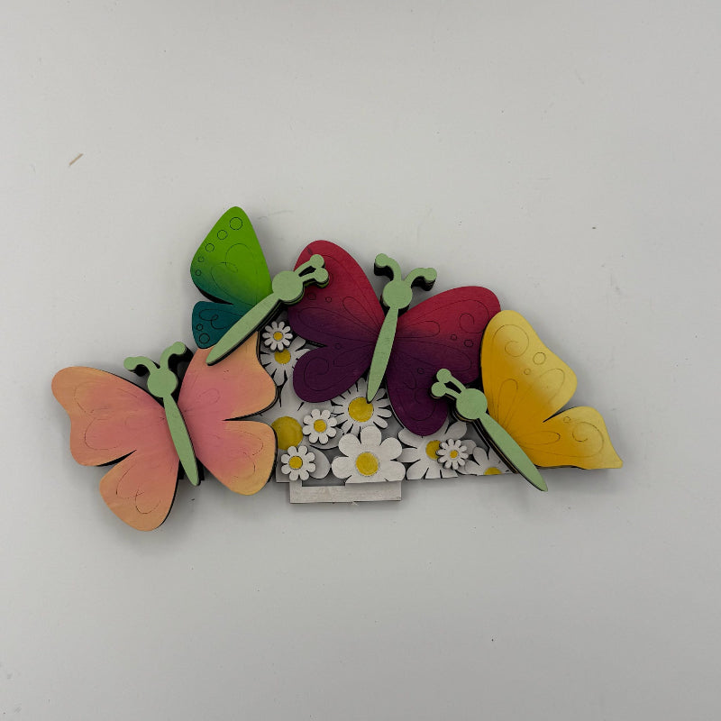 Colorful butterfly-shaped hair clip on a white background