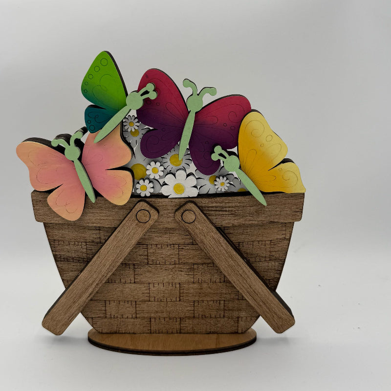 Decorative basket with colorful butterflies and flowers on a white background