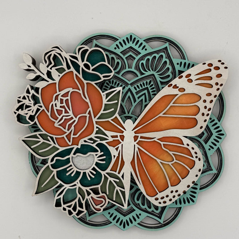 Decorative wall art with a butterfly and floral design on a white background