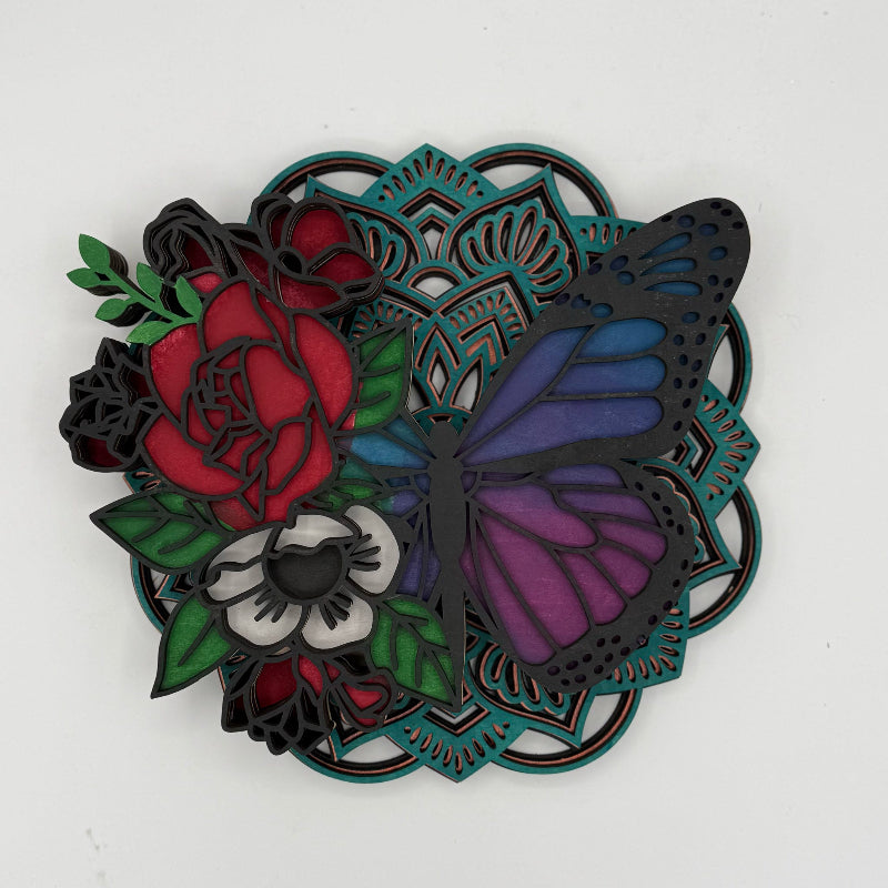 Decorative wall art with floral and butterfly design on a white background