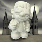 White ceramic gnome figurine on a wooden surface