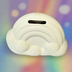 White cloud-shaped object on a wooden surface