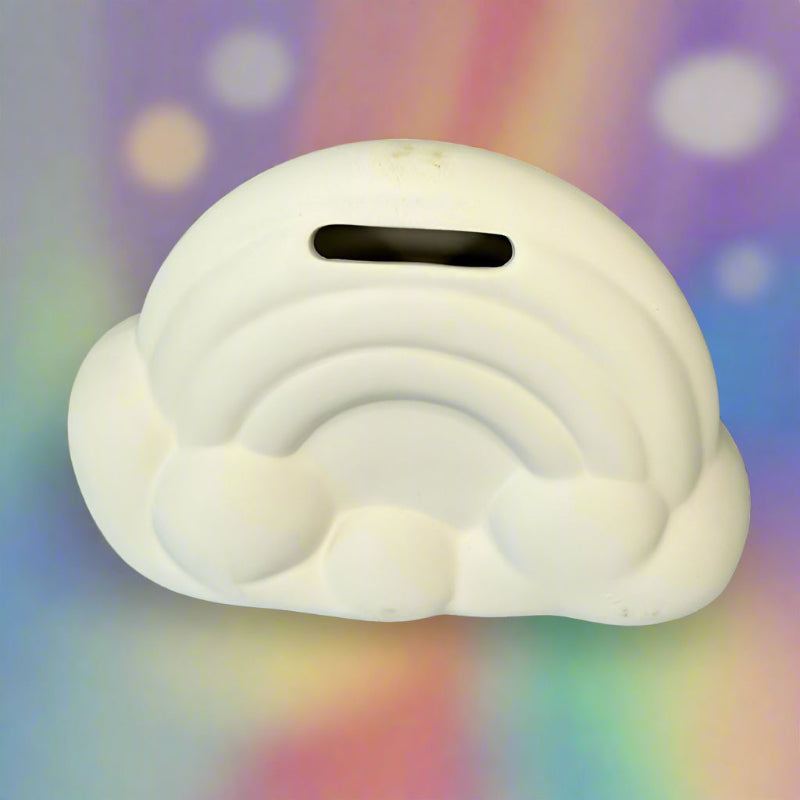 White cloud-shaped object on a wooden surface