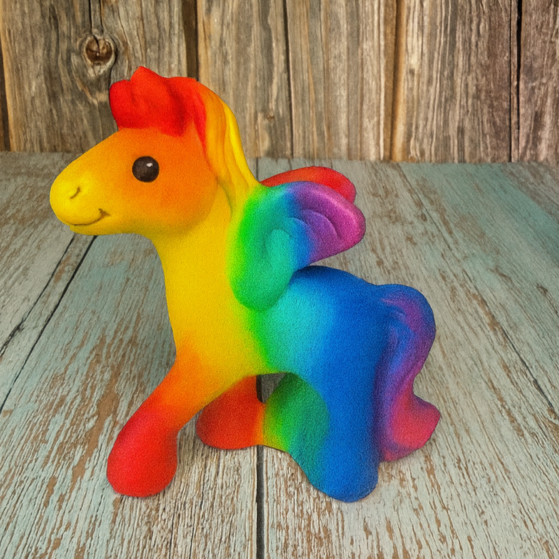 Colorful toy horse on a wooden surface