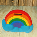 Colorful rainbow-shaped object on a wooden surface