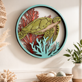 Decorative wall  with turtle design on a wall with decorative items below.