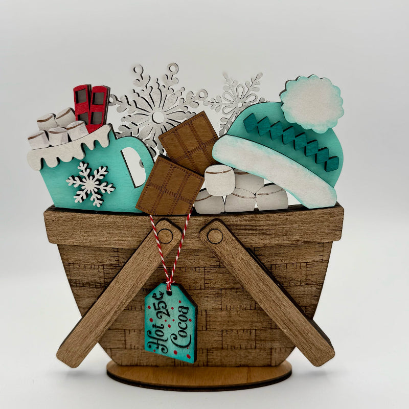 Decorative cookie set with a basket, mug, and winter-themed elements on a white background