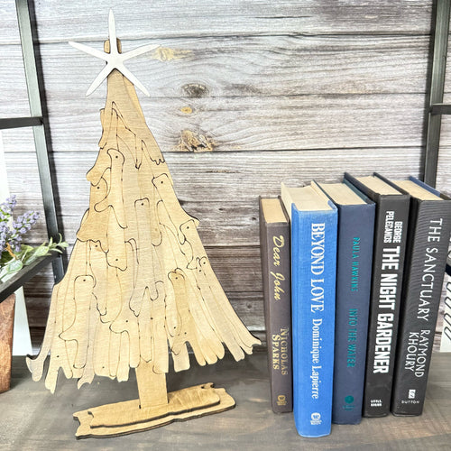 Driftwood Christmas Tree 3D project on a shelf beside a row of books