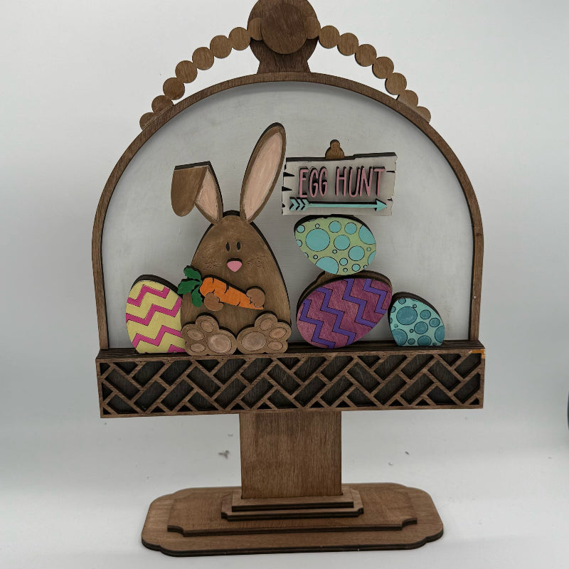 Decorative Easter display with a bunny and eggs on a white background