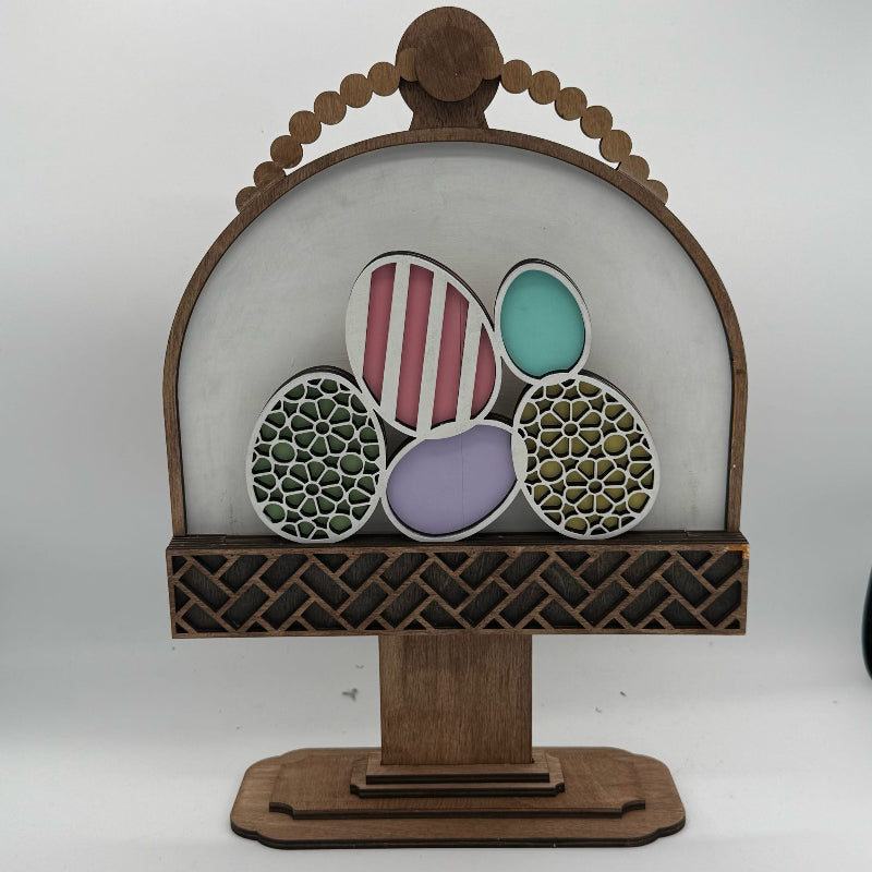 Decorative wooden stand with colorful eggs on a white background