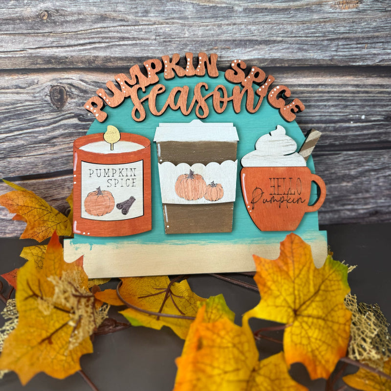Decorative sign with 'Pumpkin Season' text and autumn-themed illustrations on a wooden background.